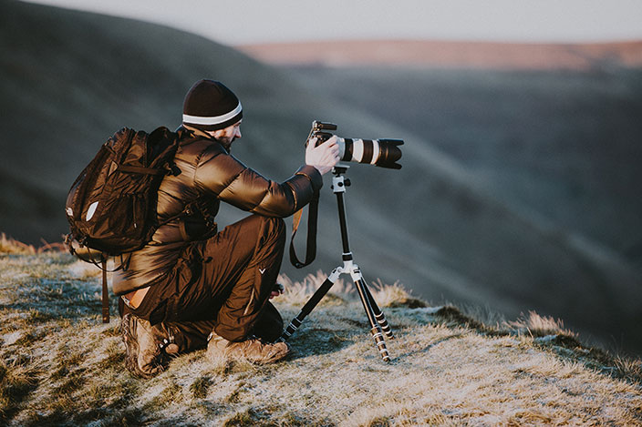 men holding camera