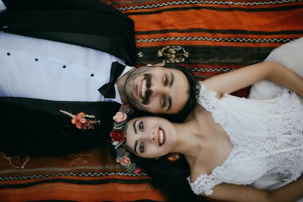 Couple lying down while smiling